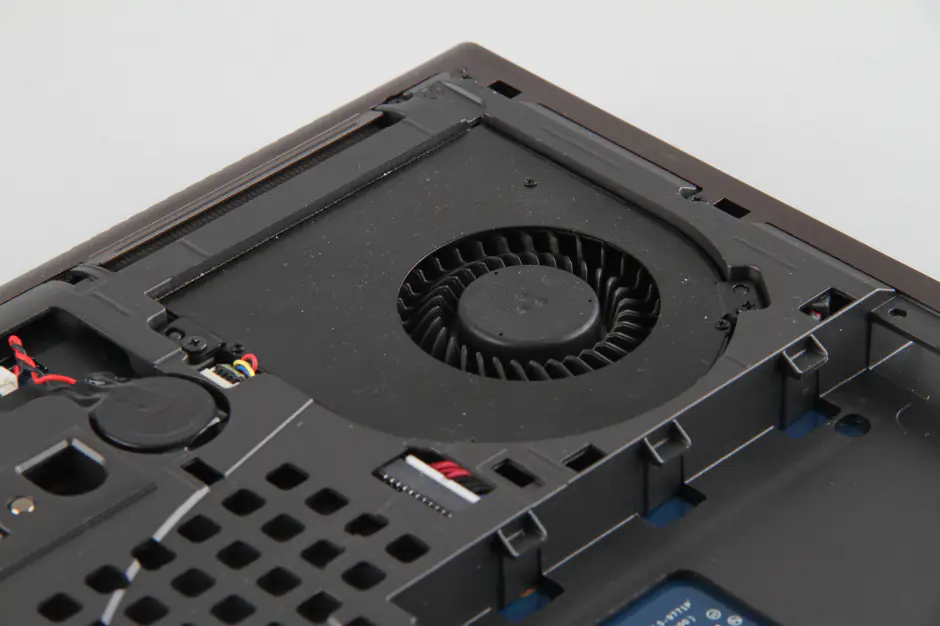 Remove two screws securing the left cooling fan